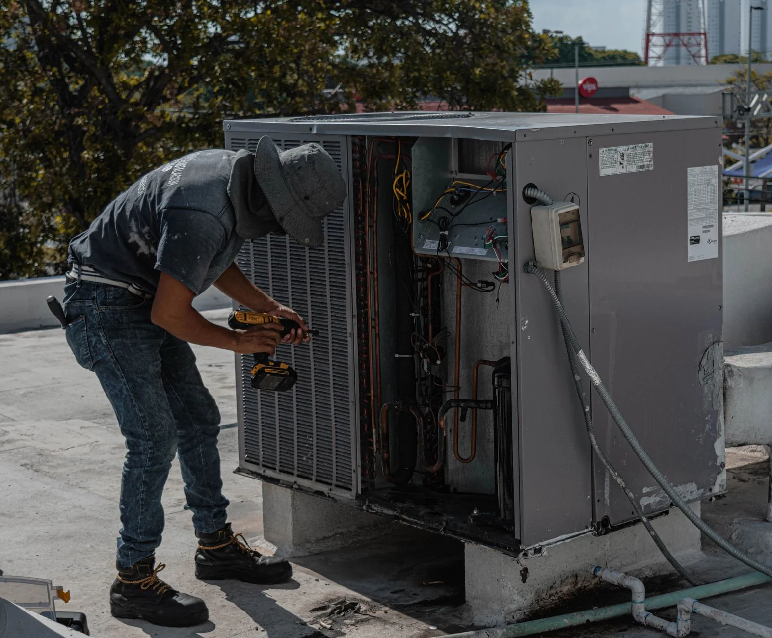 Technician checking airflow at a bedroom supply register